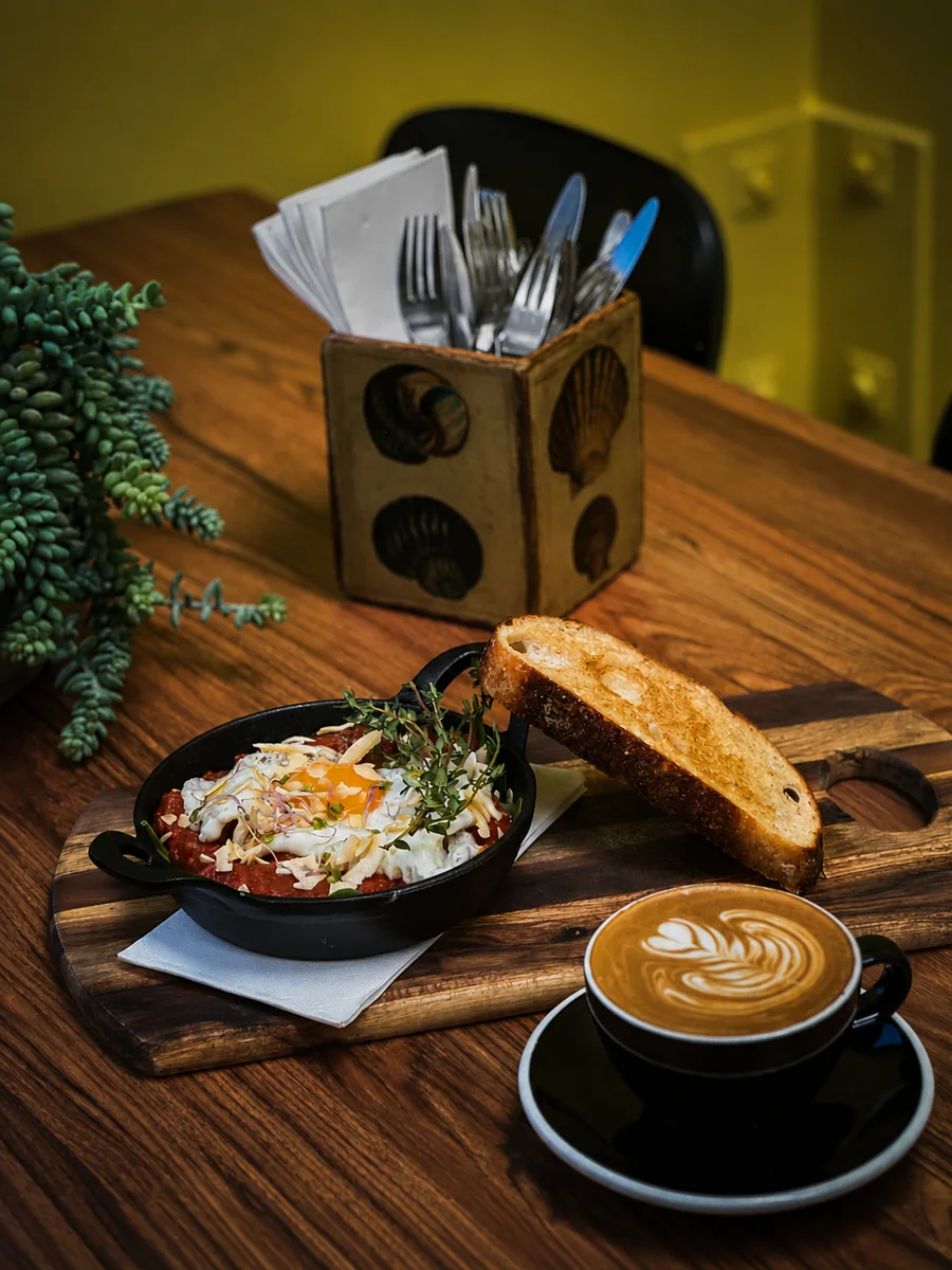 Breakfast dish and coffee at Hey Jude Cafe